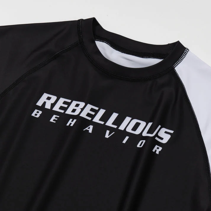 REBELLIOUS BEHAVIOR RBLS SPCS LOGO HALF RASH GUARD (BLACK)